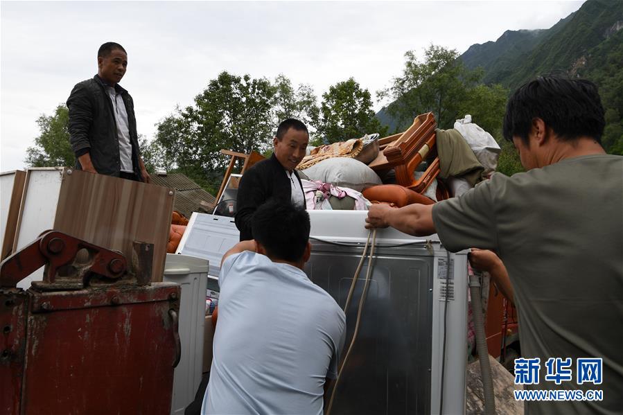 （新華全媒+）（9）千里“挪窩”，踏實開啟新生活